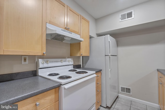 kitchen featuring white range with electric stovetop, light brown cabinetry, and light tile patterned floors