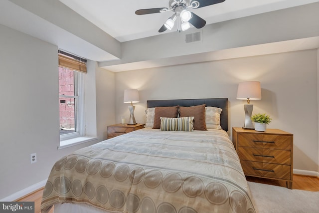 bedroom with ceiling fan and light wood-type flooring