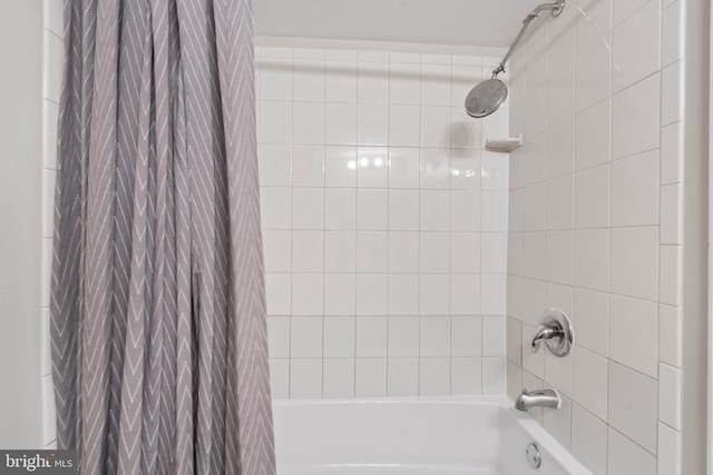 bathroom featuring shower / tub combo with curtain