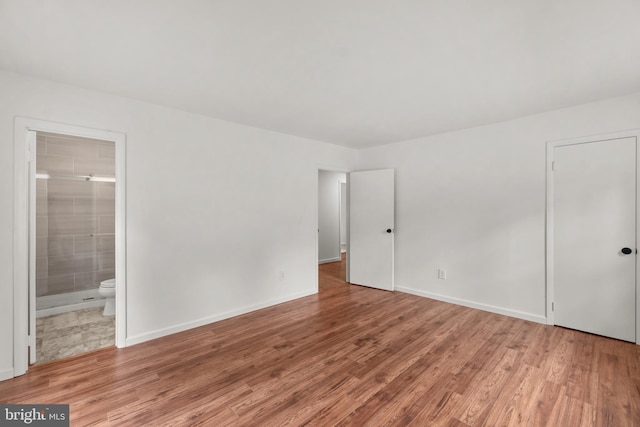 empty room featuring hardwood / wood-style flooring