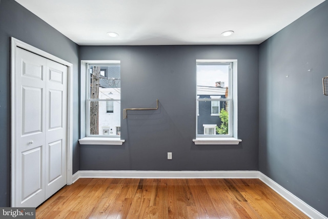 spare room featuring light hardwood / wood-style flooring