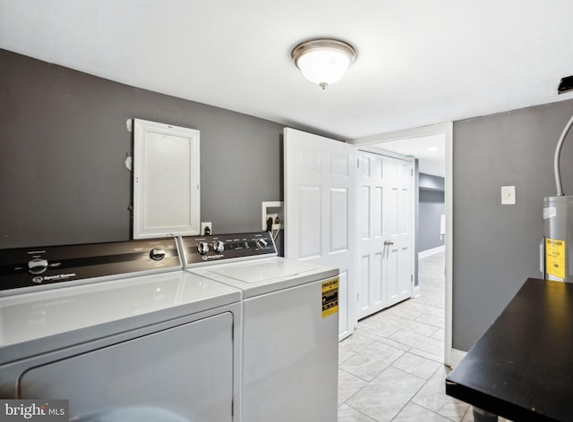 clothes washing area with separate washer and dryer