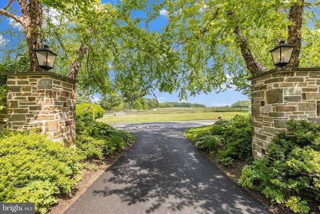 exterior space with a rural view and fence