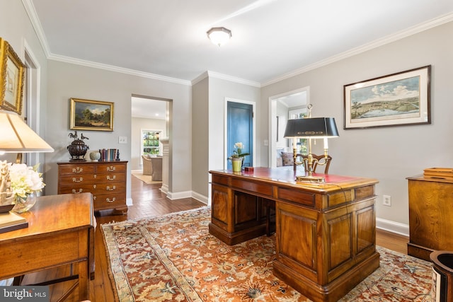 office area with dark wood-type flooring, baseboards, and ornamental molding