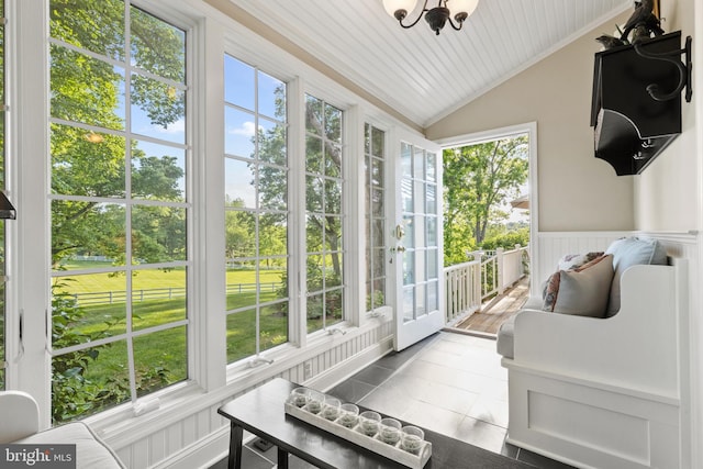 sunroom with wooden ceiling and lofted ceiling