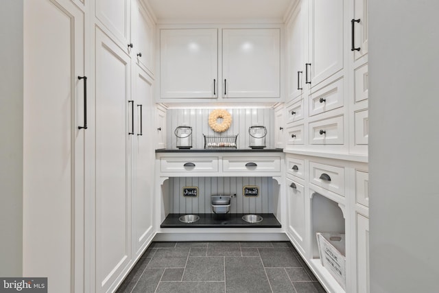 interior space featuring white cabinetry