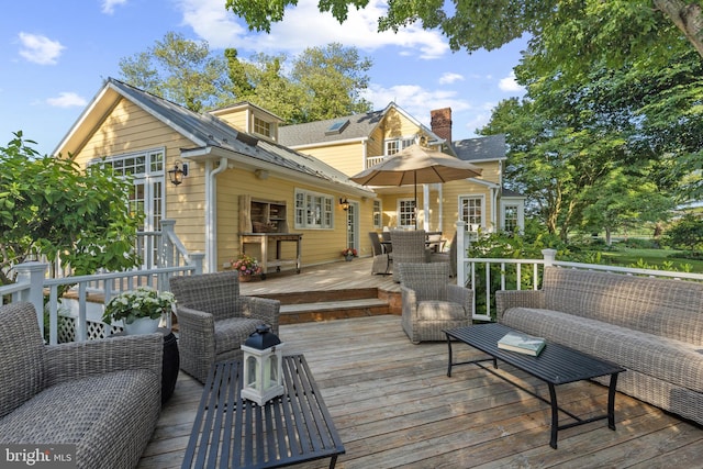 deck featuring an outdoor living space