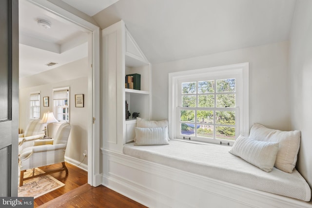 bedroom featuring vaulted ceiling, dark wood-style floors, visible vents, and baseboards