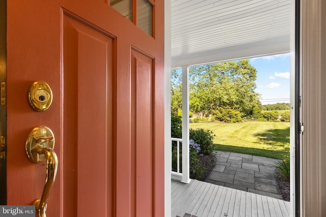 doorway to outside featuring stone finish flooring