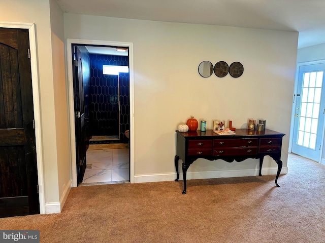 interior space featuring light colored carpet