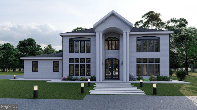 view of front of house featuring french doors and a front yard