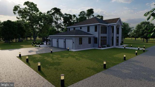 view of front of house with a garage and a front lawn