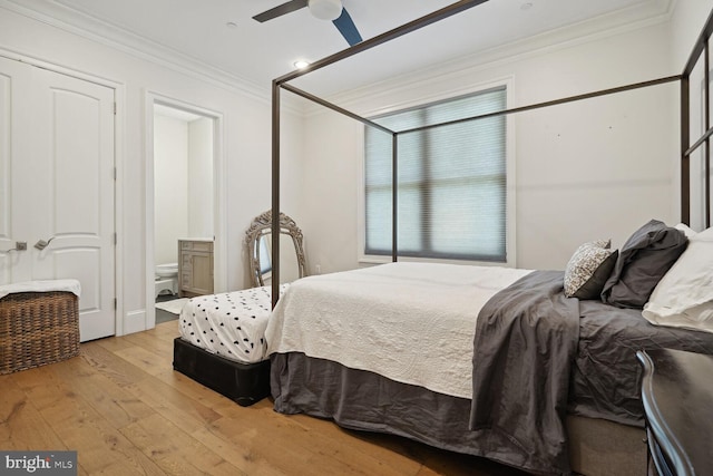 bedroom with crown molding, ceiling fan, ensuite bathroom, and light hardwood / wood-style floors