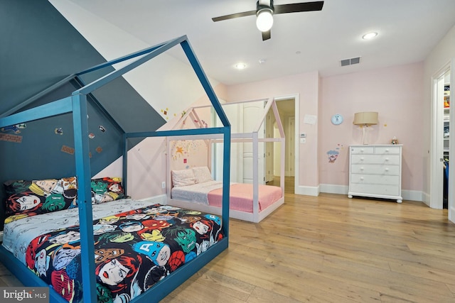 bedroom featuring hardwood / wood-style flooring and ceiling fan