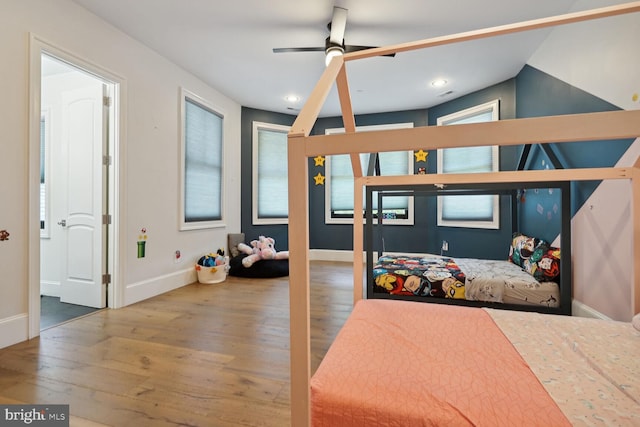 bedroom featuring hardwood / wood-style floors and ceiling fan