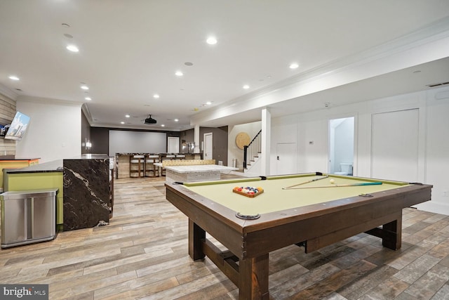 recreation room with crown molding, light hardwood / wood-style flooring, and pool table