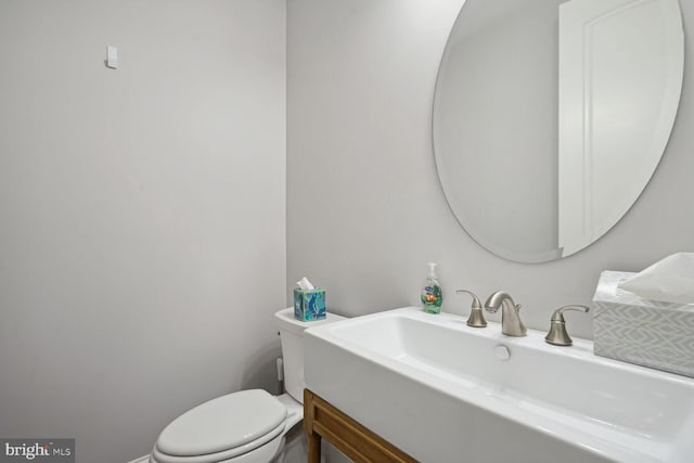 bathroom with sink and toilet