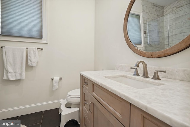 bathroom with tile patterned flooring, vanity, toilet, and a shower with shower door