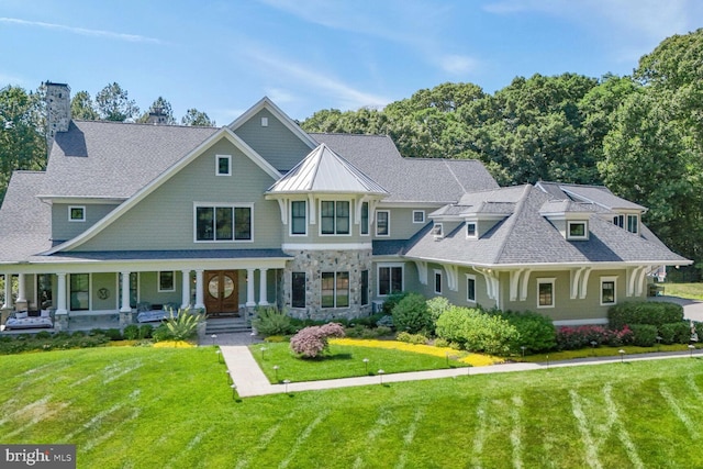 view of front of home with a front lawn and a porch