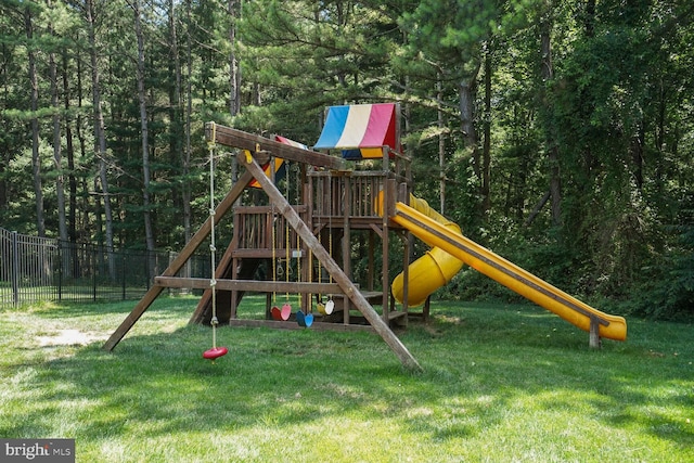 view of jungle gym featuring a lawn