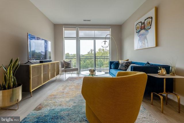 living area with visible vents and light wood-type flooring