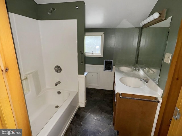 bathroom with vanity and washtub / shower combination