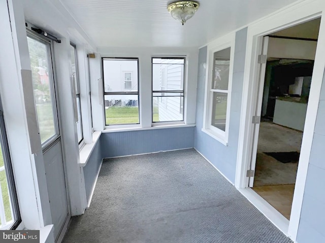 unfurnished sunroom featuring a healthy amount of sunlight