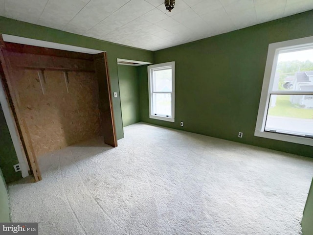 unfurnished bedroom with carpet flooring