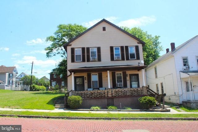 view of front of home featuring a porch and a front yard