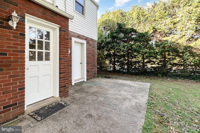 entrance to property with a patio