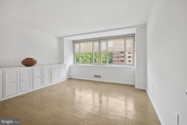 unfurnished room featuring light hardwood / wood-style flooring