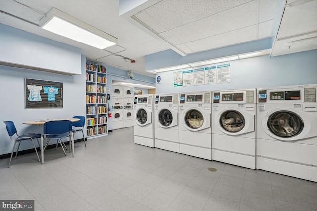 washroom featuring stacked washer and dryer and washing machine and clothes dryer