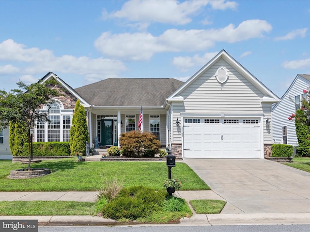 view of front of property featuring a garage and a front lawn