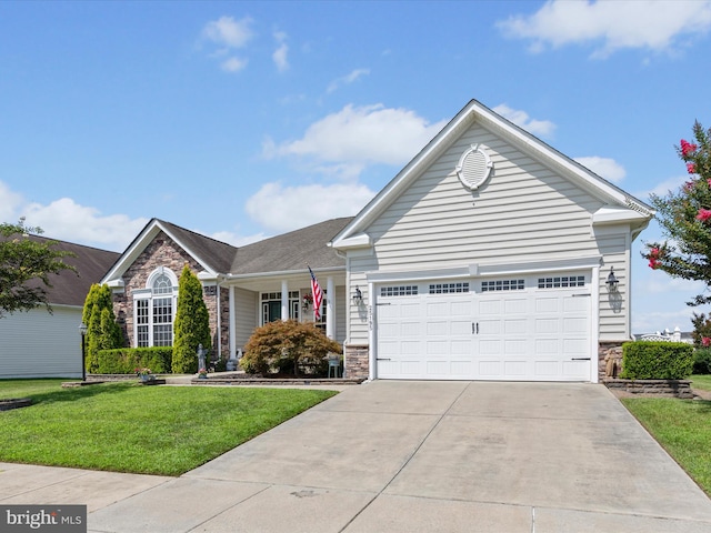 view of front of house featuring a front yard and a garage