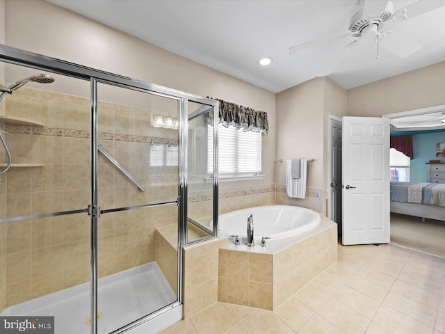 bathroom with ceiling fan, shower with separate bathtub, and tile patterned flooring