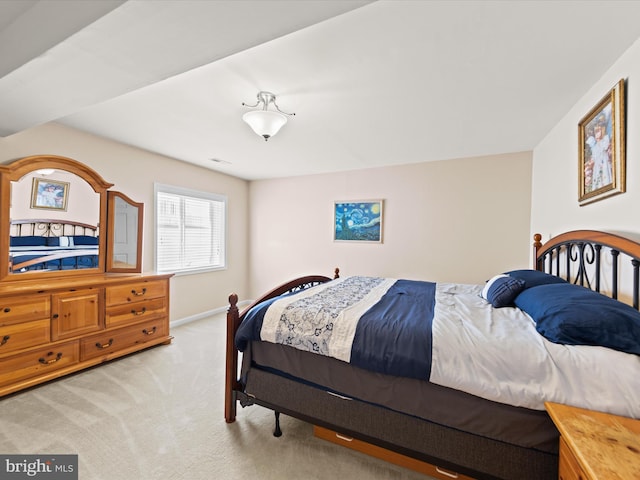 bedroom with light carpet