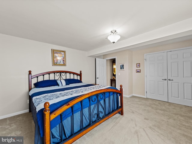 bedroom featuring a closet and carpet