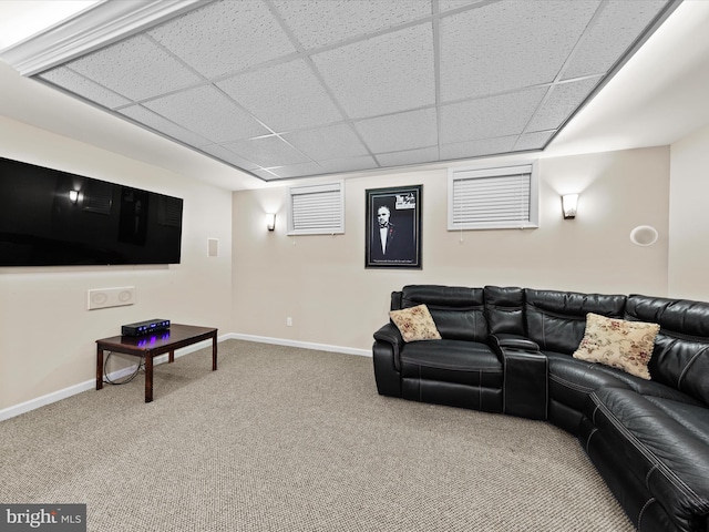 carpeted living room featuring a paneled ceiling