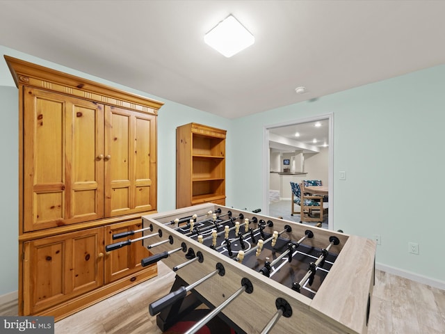 playroom with light hardwood / wood-style floors