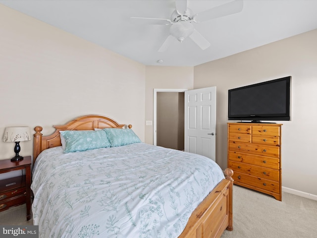 bedroom featuring ceiling fan and light carpet