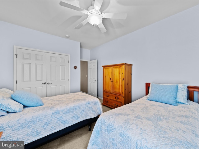 carpeted bedroom with a closet and ceiling fan