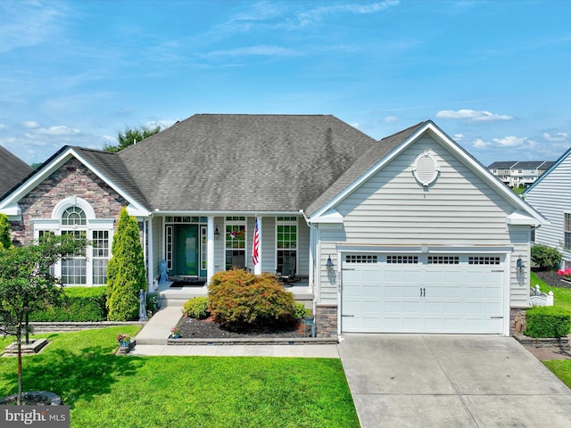 view of front of house with a garage and a front yard