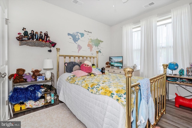 bedroom with hardwood / wood-style floors