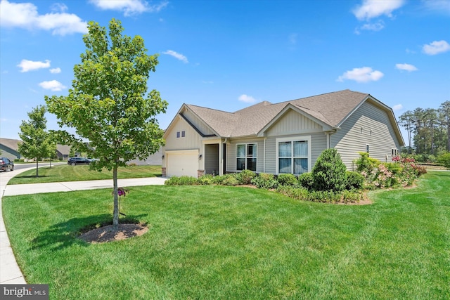 view of front of home with a garage and a front lawn