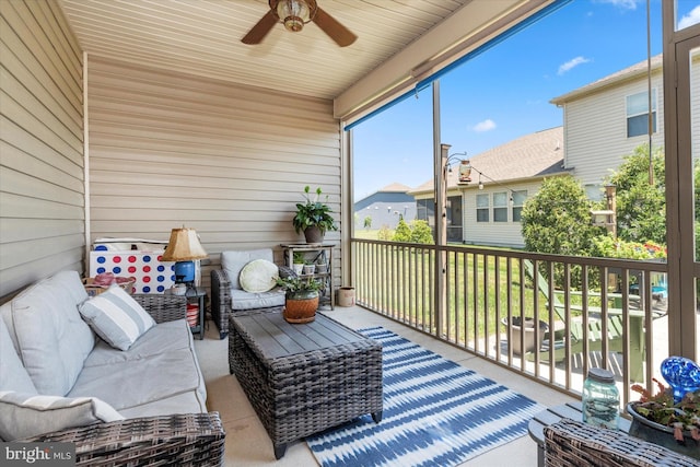 sunroom / solarium featuring ceiling fan and wooden ceiling