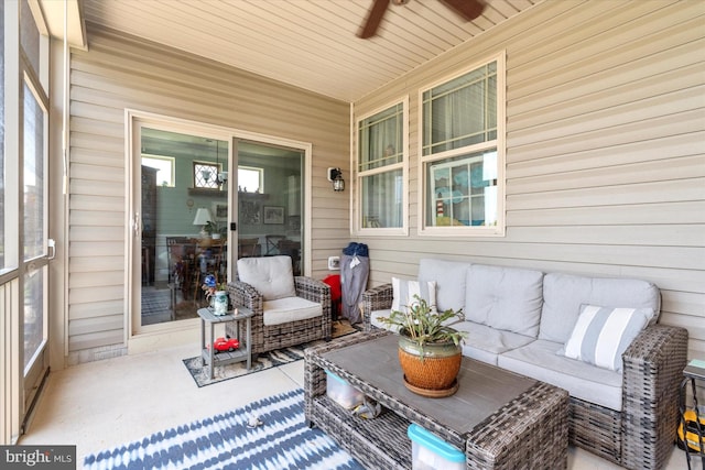 sunroom / solarium featuring ceiling fan