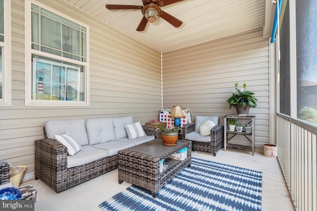 sunroom featuring ceiling fan and wood ceiling