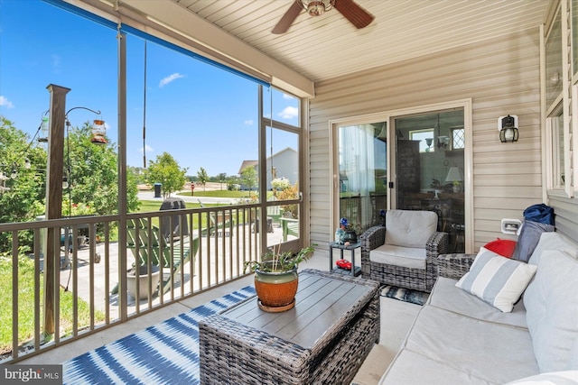 sunroom featuring ceiling fan