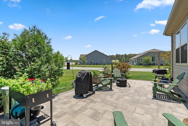 view of patio with a fire pit and area for grilling