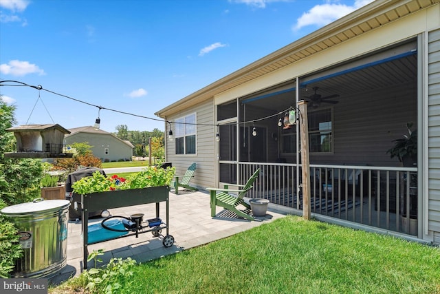 view of patio with a sunroom